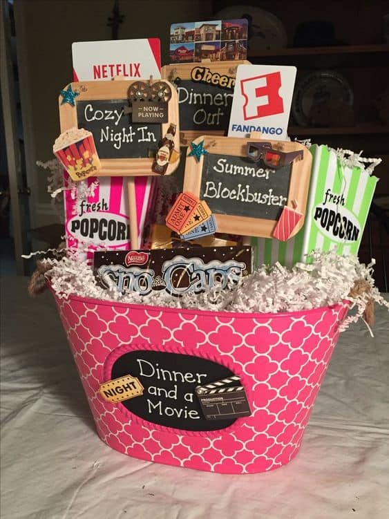 plastic bucket filled with movie gift cards and treats